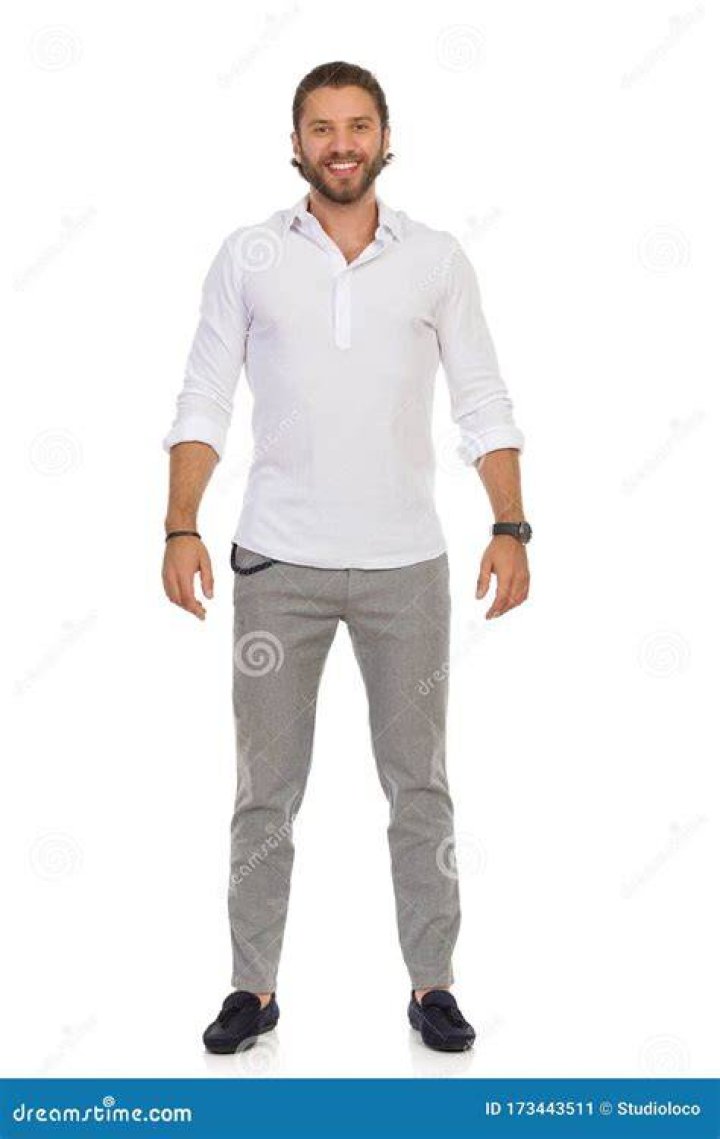 a man standing in front of a white background