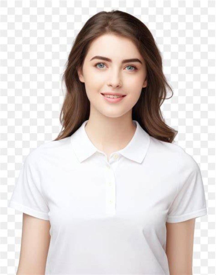 a woman in a white dress smiling at the camera