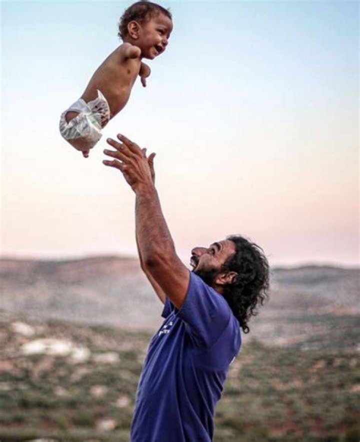 Discover Hope And Resilience: Limbless Pastor's Heartwarming Photo
