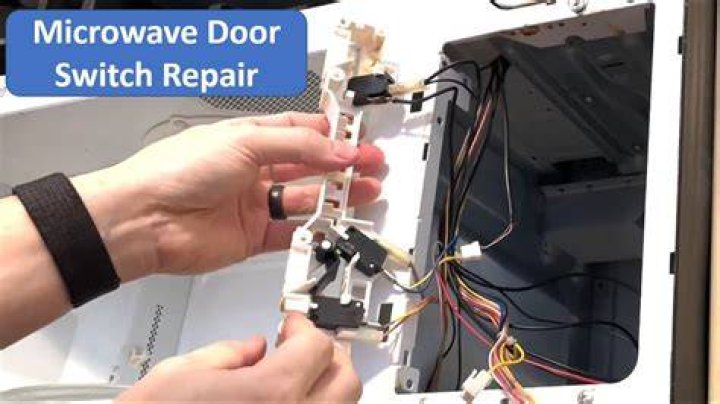 How do I clean the inside of my microwave door?