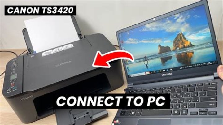How do I connect my Canon Rebel XS to my computer?