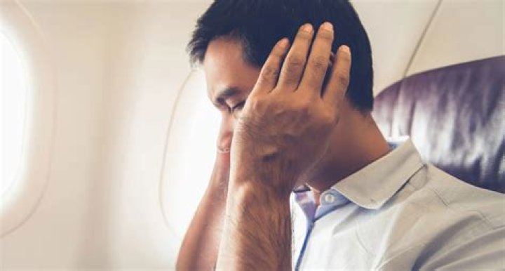How do I stop my ears from hurting on a plane?