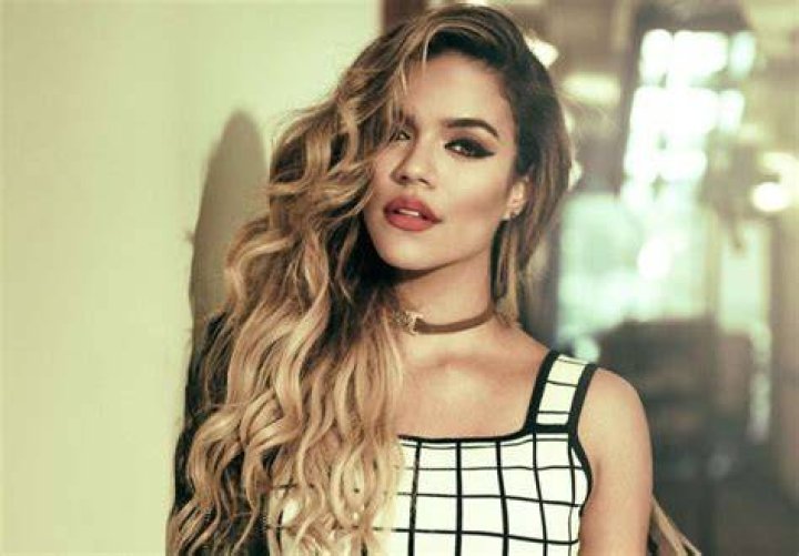 Karol G Apologizes To Offended Fans After She Uses Her Bulldog To