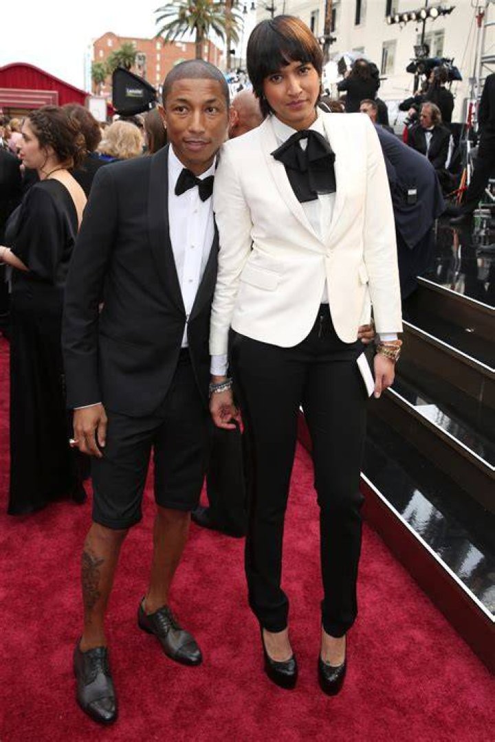 Pharrell Williams and his wife Helen Lasichanh cosy up at Chanel's PFW